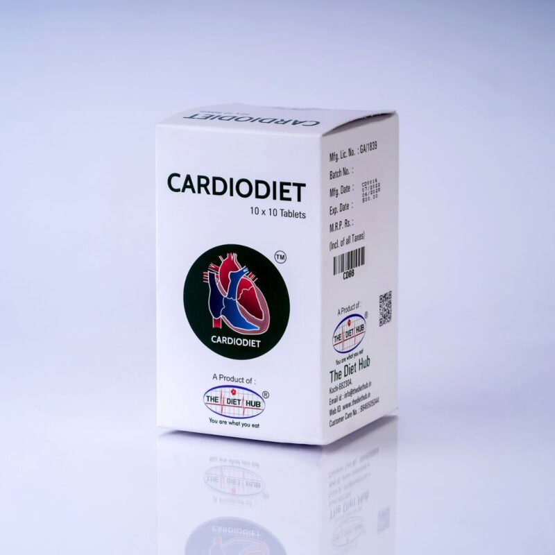 A cardboard box of Cardiodiet tablets on a table. The box has a red, white, and blue design with the product name and The Diet Hub logo